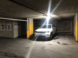 Illegally parked car with someone sleeping in it.